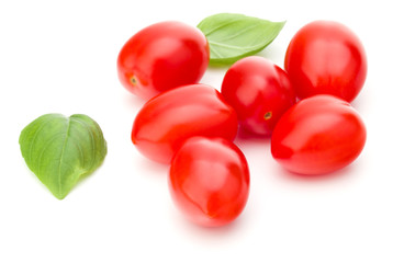 fresh plum tomato with basil leaf isolated on white background