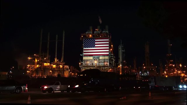 semi-trailer truck shipping next to American Oil gas refinery Industry plant, Global Warming and Climate Change Concept