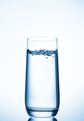 water glass on blue background
