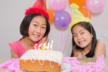 Obraz na płótnie Canvas Cute little girls at birthday party