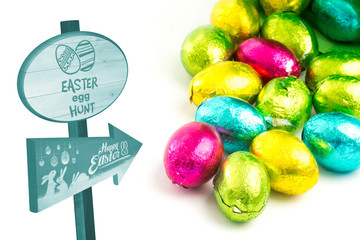 Easter egg hunt sign against colourful easter eggs