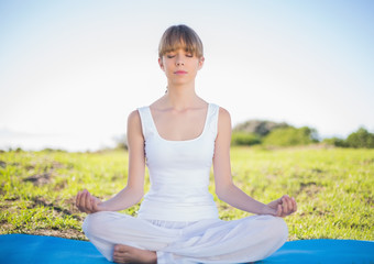 Content natural young woman doing yoga