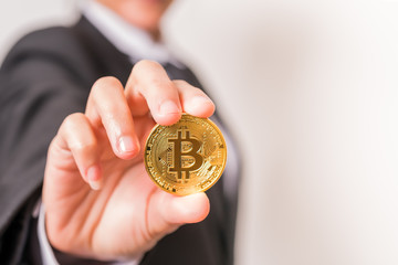 Fototapeta na wymiar cryptocurrency coins - Bitcoin, Ethereum, Litecoin, Ripple. Women hold the cryptocurrency coin on hand. Physical bitcoins gold and silver coins