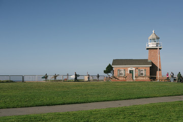 lighthouse surfers