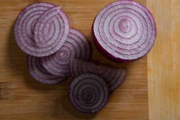 Sliced onions on chopping board