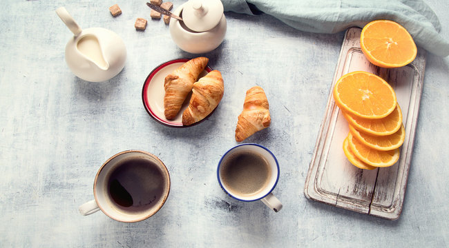 Breakfast with cup of coffee and croissants