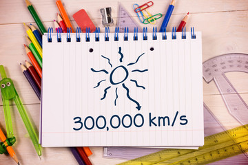 Distance to the sun on notepad against students desk