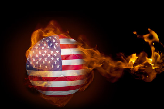 Composite image of fire surrounding usa ball against black