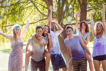 Happy friends jumping in the water shoot