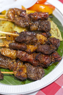 Indonesian grilled meats in wooden skewers, island Bali, Indonesia