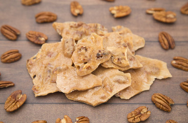 Homemade Pecan Brittle on a Wooden Table