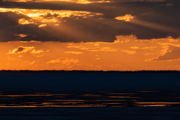 Fototapeta na wymiar Sunset over the Ob reservoir.