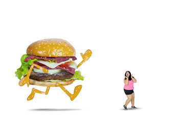 Big hamburger chasing fat woman on studio