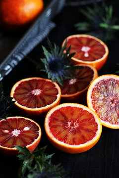 blood orange slices,on a dark  background.top view.low key style