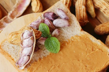 Creamy peanut butter smeared on bread delicious