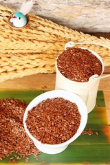 Flax seeds for health on wood background