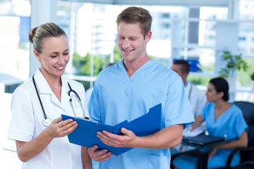 Team of doctors working on their files