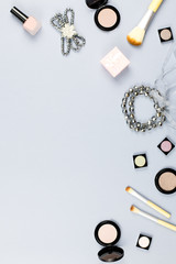 Fashion accessories, makeup products, jewelry and handbag on pastel background. Beauty and fashion concept, flat lay