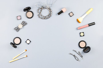 Fashion accessories, makeup products, jewelry and handbag on pastel background. Beauty and fashion concept, flat lay