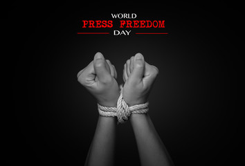 Woman hands were tied with a rope. Violence, Terrified, Human Rights Day and world press freedom...