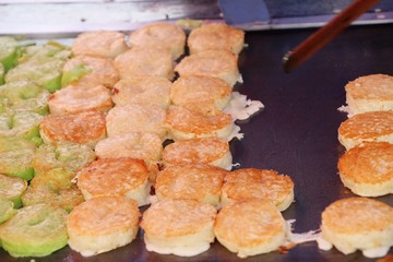 flour mix coconut and then fried ,Thai dessert