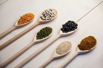 Wooden spoons of pulses and seeds
