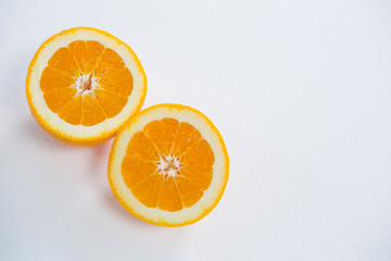 Ripe tasty orange cut into two halves