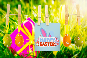 happy easter against pink gift with easter egg and yellow tulip