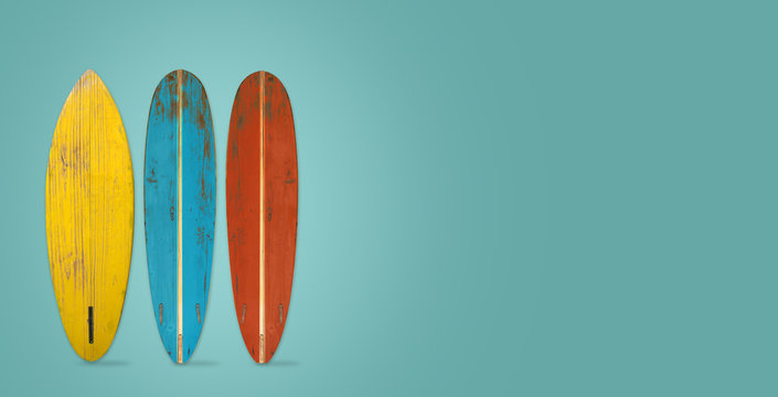 Vintage surfboard on color background. flat lay, top view hero header. vintage color styles.