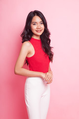 Portrait of beautiful young Asian woman in red shirt.