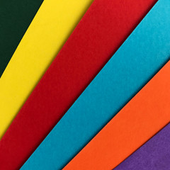 Background of a colorful paper. Green, yellow, red, blur, orange and purple.