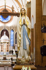 Pavia, Italy. December 2 2017. The statue of Our Lady of Lourdes in the "Santa Maria del Carmine" church (Holy Mary of Carmel)