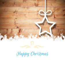 Christmas greeting card against christmas decorations over wood