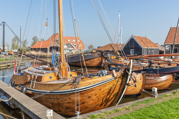 Historical ships and fishing vessels anchored in harbor Dutch fishing village Workum