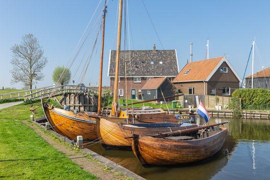 Historical ships and fishing vessels anchored in harbor Dutch fishing village Workum