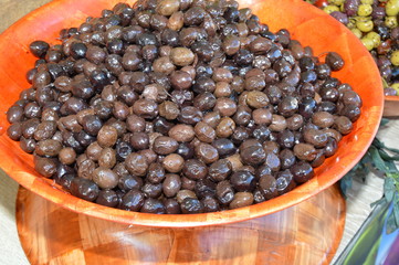 Zoom on few olives in a bowl