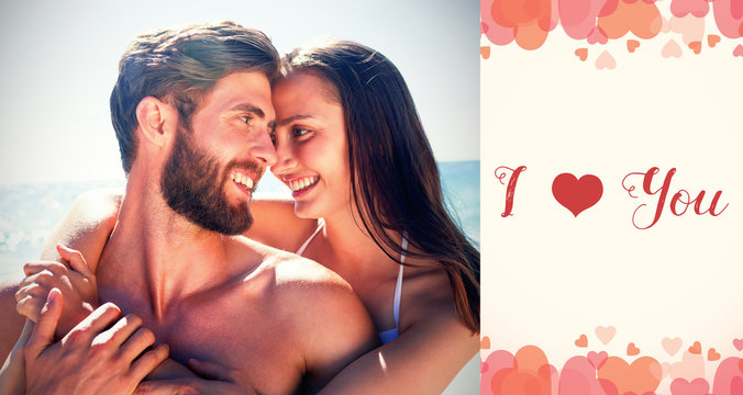 Composite image of happy couple embracing on beach and sweet words