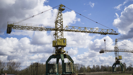Old, rusty gantry crane, an abandoned plant. Collapse of economy, and shutdown of production...