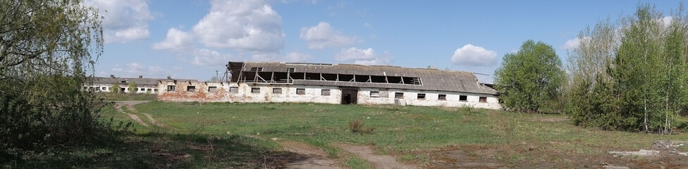 Fototapeta na wymiar One km. near Chernobyl area border. Abandoned huge milk farm. Panorama. 