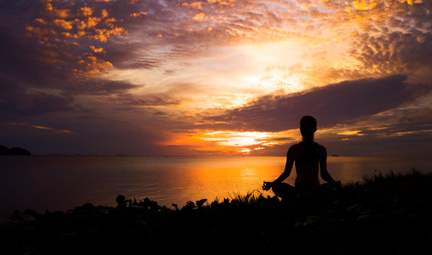 Serenity and yoga practicing at sunset,meditation