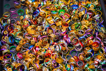 Fototapeta na wymiar Colourful metal rings on display at Camden market in London