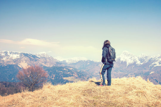 Sportive girl on mountain peak, Woman looking the beautifull landscape