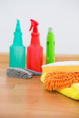 Obraz na płótnie Canvas Close-up of chemical spray bottles and cleaning spone