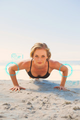 Fototapeta premium Fit blonde in plank position on the beach against fitness interface