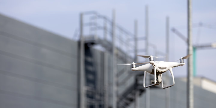 Modern drone flying outdoor, RF photo, no logos or trademarks