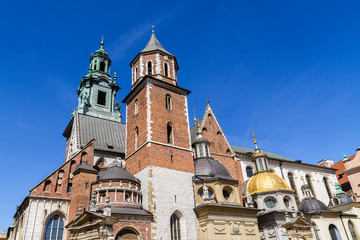 Fototapeta na wymiar Roof towers of cathedral on Wawel castle, Cracow, Poland.