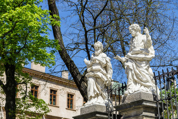 Fototapeta na wymiar Two statues of saints in Krakow, Poland