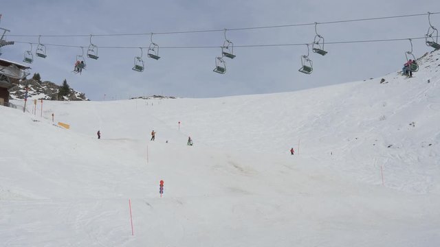 Chairlifts running above a ski slope