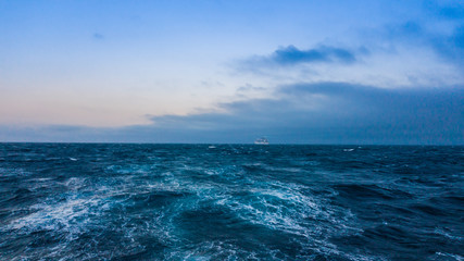 Seascape. Cruise ship in the distance on the horizon.