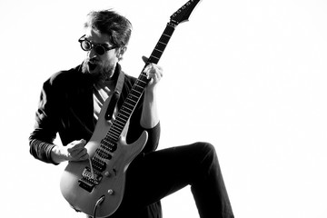 guitarist in glasses rock plays guitar music